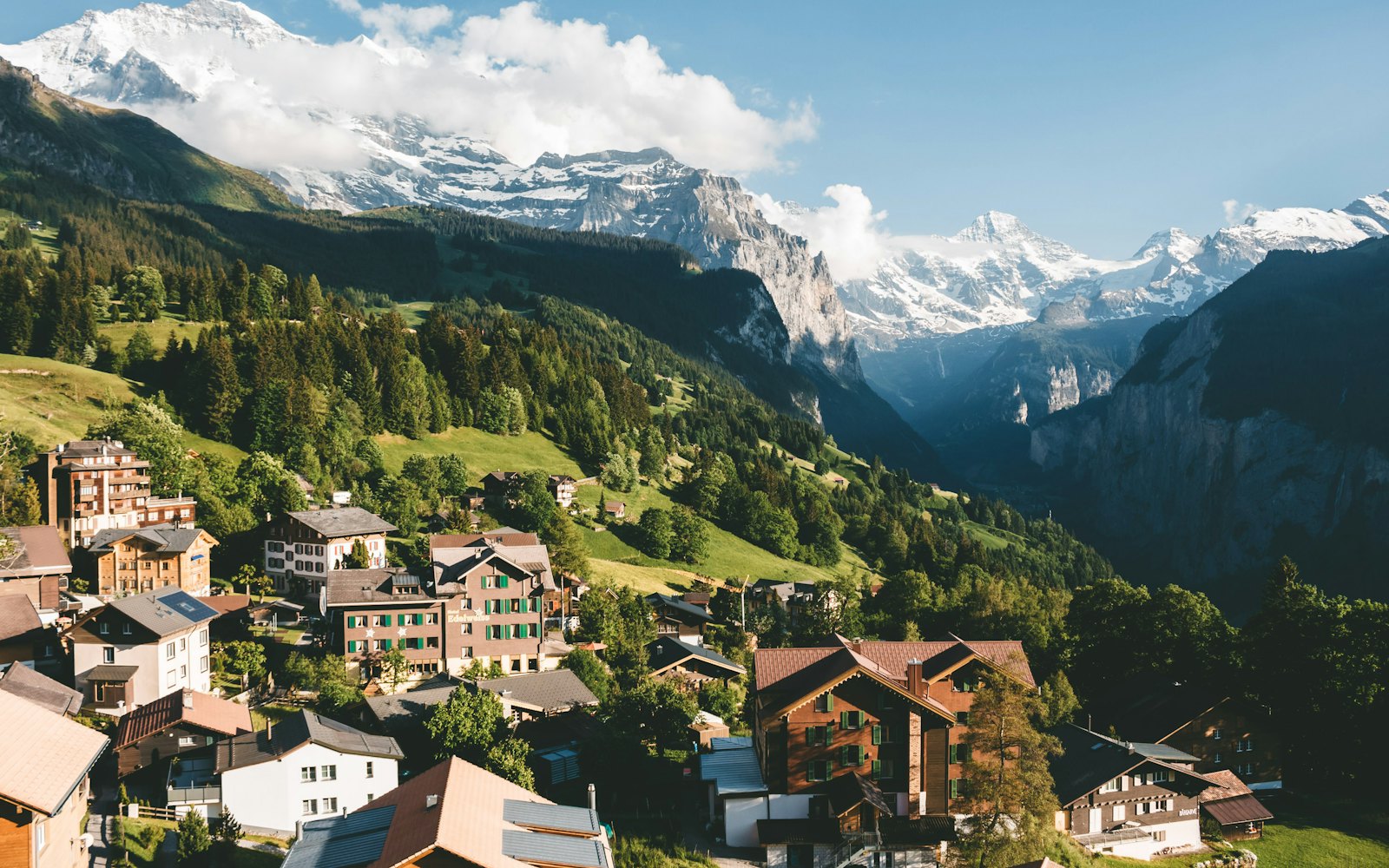 Alpine village on green Swiss hillsides